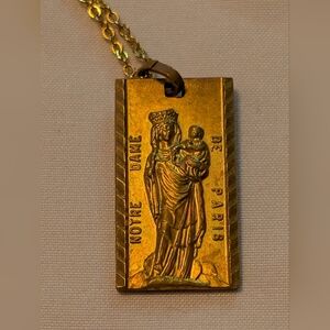 Gold-plated vintage pendant depicting the Virgin Mary and Child. 1950's.